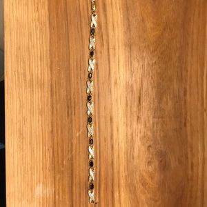 Gold tone bracelet with deep blue stones